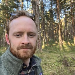 Photo of Rolandas walking in the forest